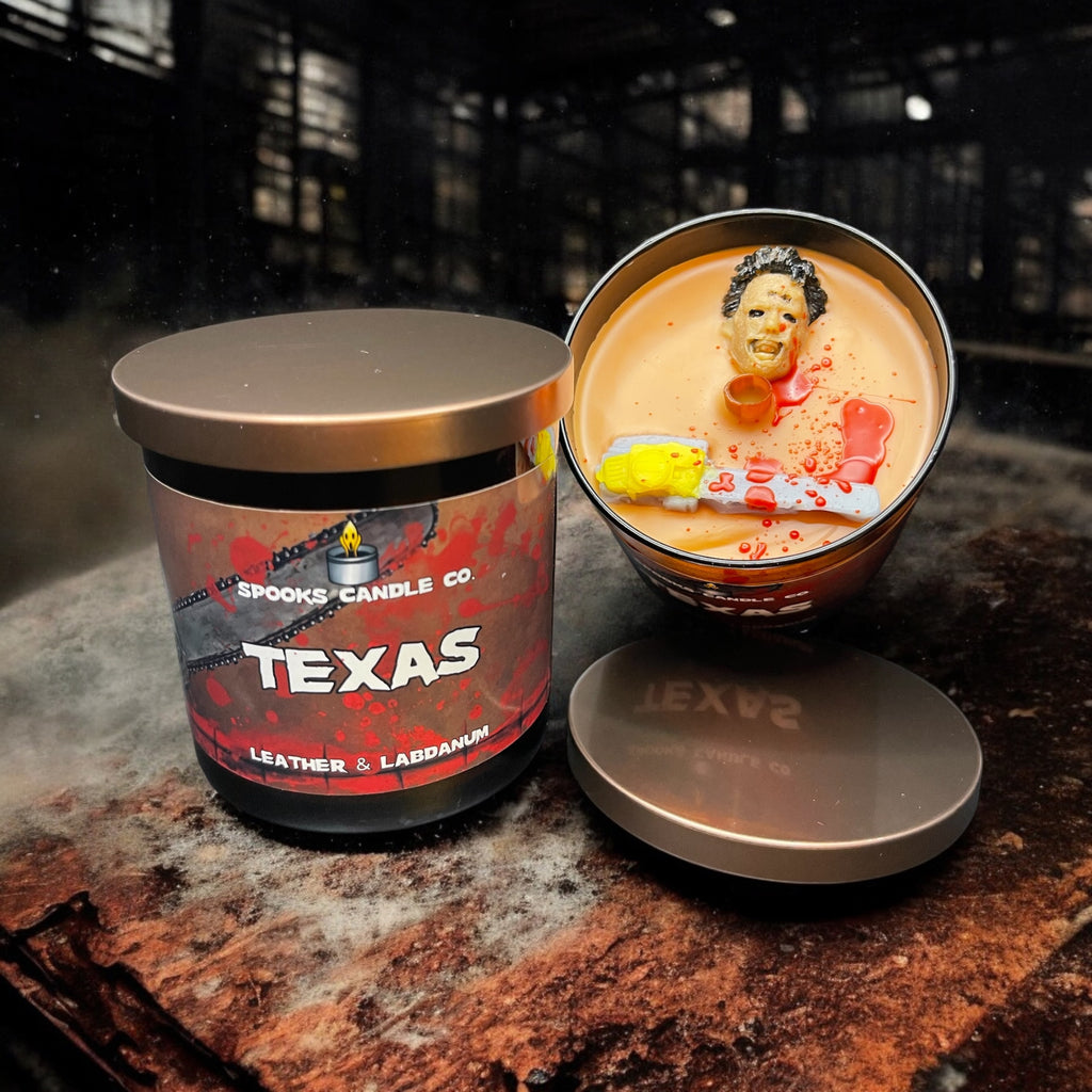 Texas Chainsaw inspired candle with Leatherface and a chainsaw in a brown glass candle